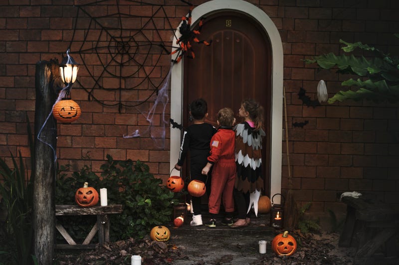 Stock image of kids trick-or-treating on Halloween