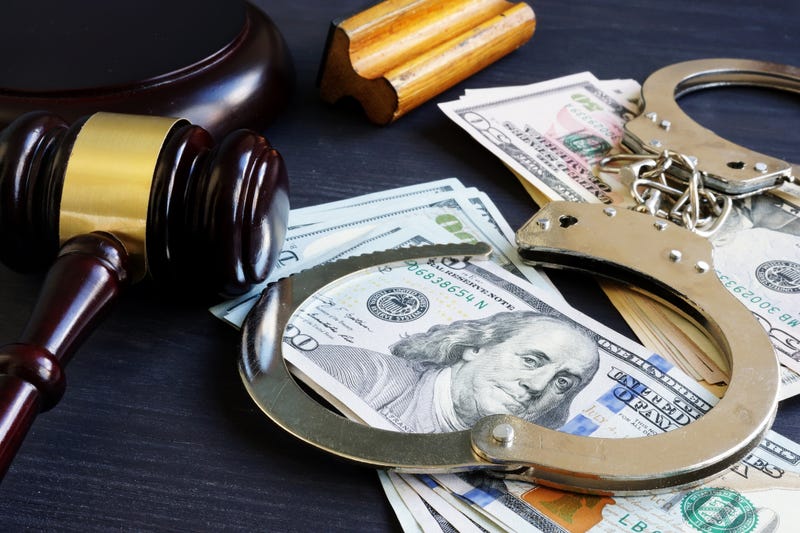 gavel, handcuffs, and money