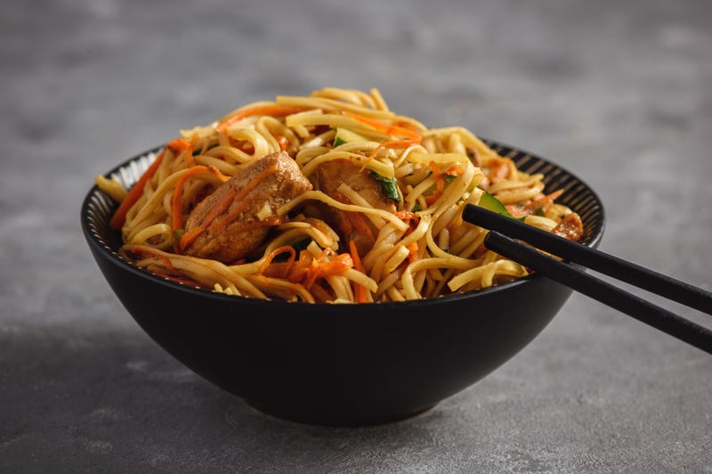 File Photo: Spicy asian noodles with chicken and vegetables.
