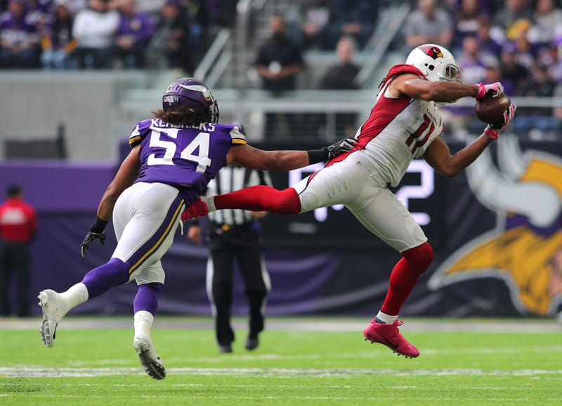 Larry Fitzgerald #11 of the Arizona Cardinals dives to catch the ball in the fourth quarter of the game against the Minnesota Vikings at U.S. Bank Stadium on October 14, 2018 in Minneapolis, Minnesota. 