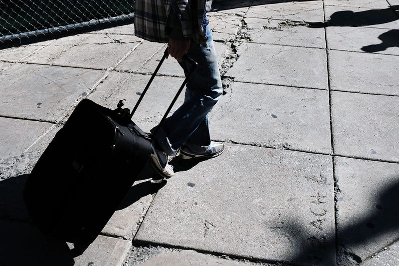 A man walks along a Philadelphia street. U.S. Census data indicates that, while sections of the city are thriving, homelessness and generational poverty are a persistent problem.