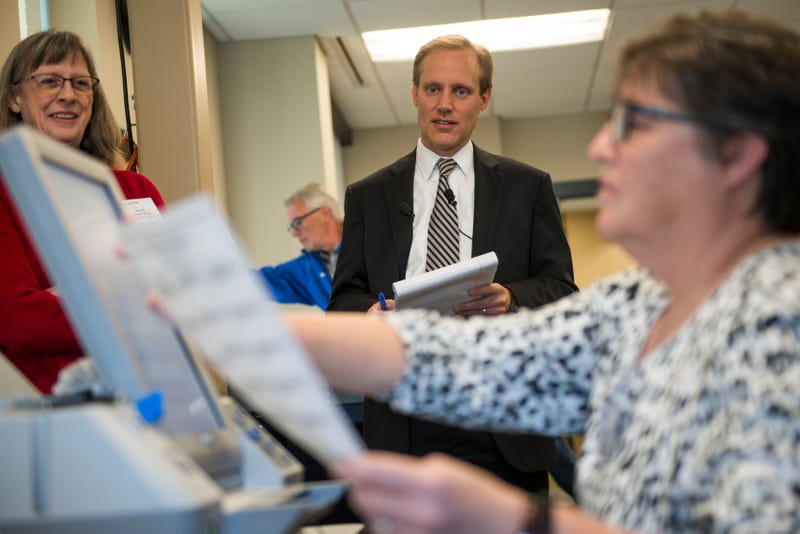 The Justice Department’s Civil Rights Division on Wednesday announced the filing of federal lawsuits against six states for what it said was a refusal to turn over voter registration lists. In Minnesota, Sec. of State Steve Simon (center) says that information is meant to be private.