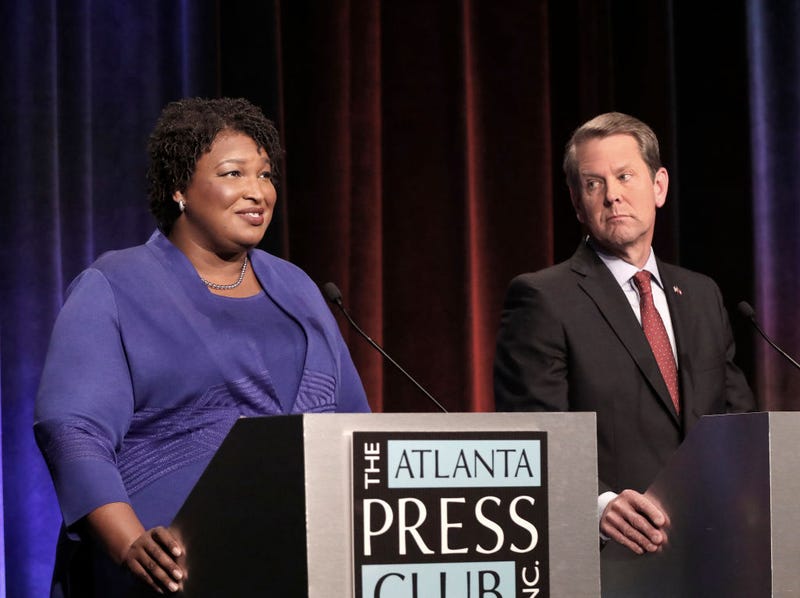 Georgia gubernatorial candidates (L-R) Democrat Stacey Abrams and Republican Brian Kemp debate in an event that also included Libertarian Ted Metz at Georgia Public Broadcasting in Midtown October 23, 2018 in Atlanta, Georgia. (Photo by John Bazemore-Pool/Getty Images)