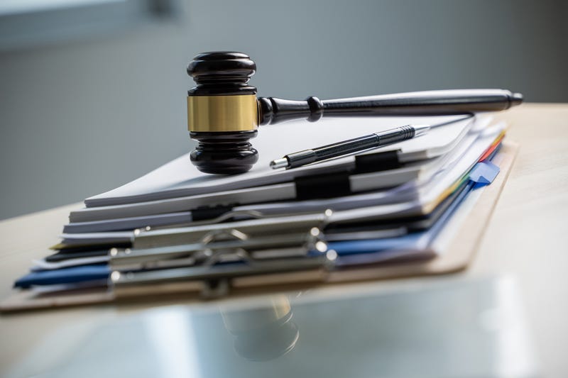 gavel on top of medical files