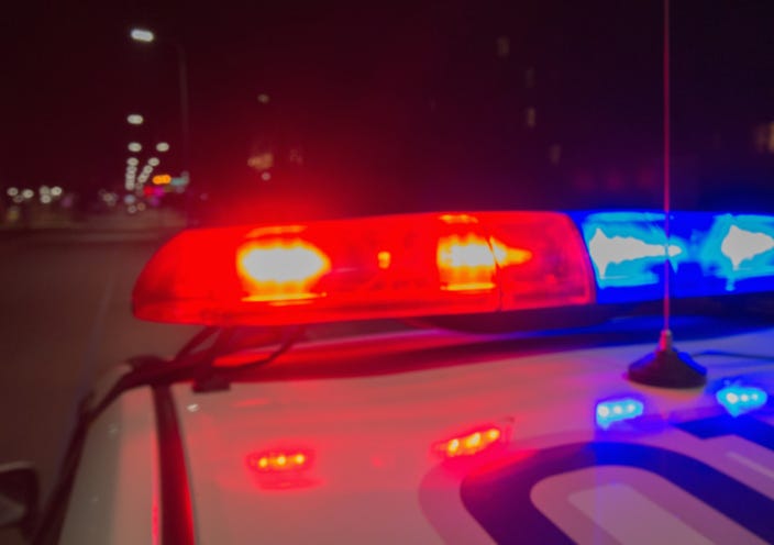 police on crash scene at night