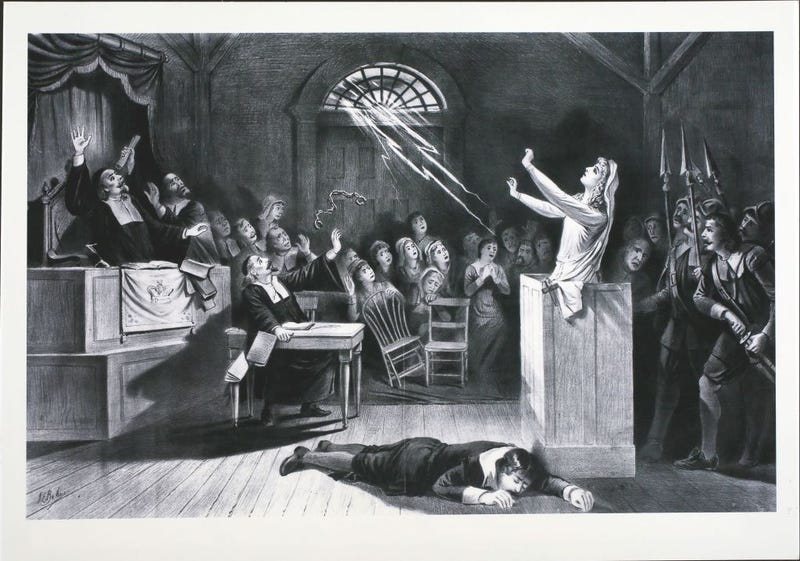Witch Trial, A young woman accused of witchcraft by Puritan ministers appeals to Satan to save her, circa 1692. (Photo by Hulton Archive/Getty Images)