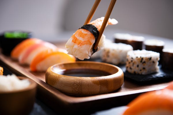 Chopstick with nigiri sushi piece 