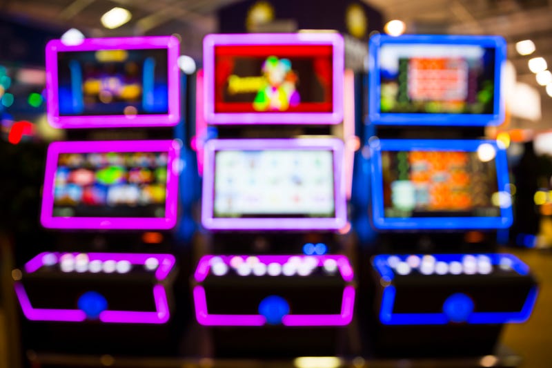 Out of focus blurry image of casino equipment. Blurred slot machines in a casino.