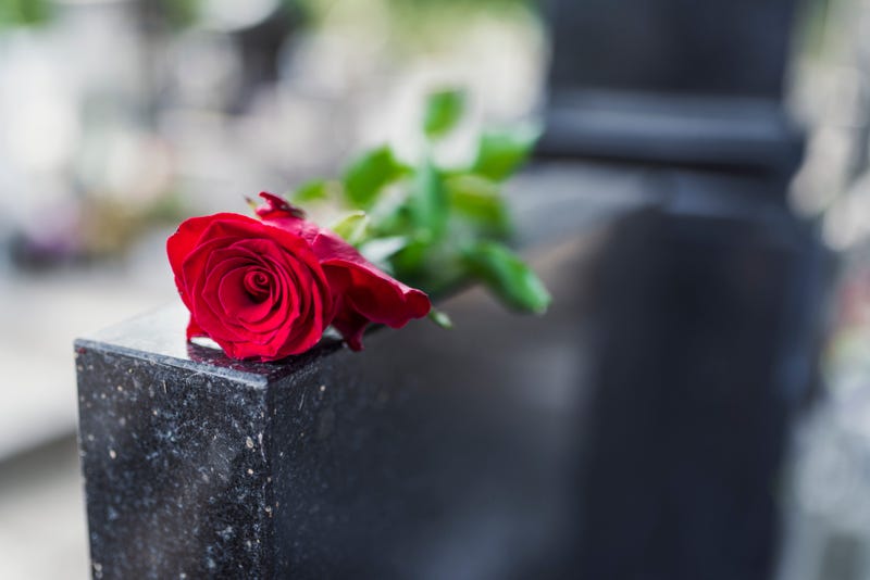 Gravestone with rose