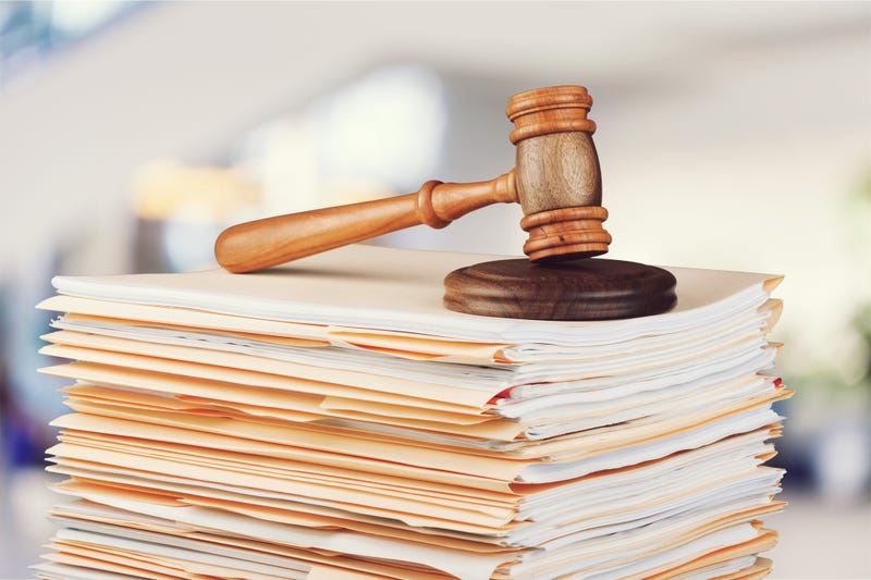 Legal filings under a gavel. 