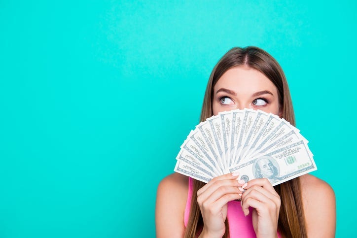 Woman holding money