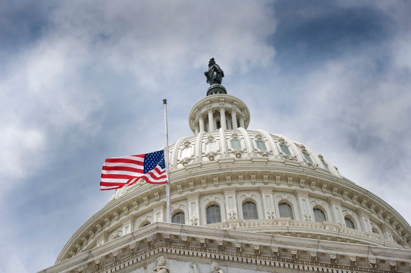 American flag flying at U.S. Capitol. 