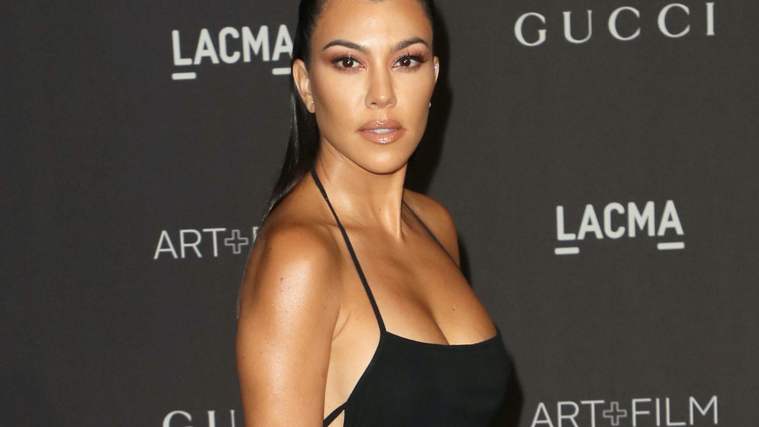 Kourtney Kardashian shuts down body-shamers for thinking she’s pregnant in new photo