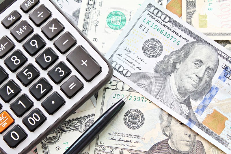 Calculator, pen lay on money