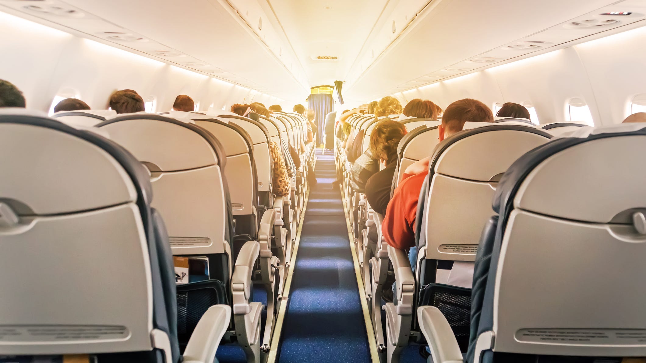 Woman kicks, spits on fellow passengers in mid-air face mask argument