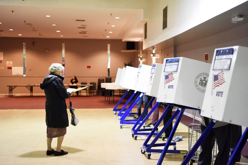 People are seen voting at a polling place on Staten Island in a past election