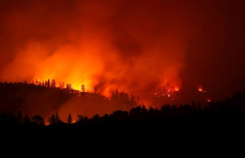 The Camp Fire burns in the hills on November 11, 2018 near Oroville, California