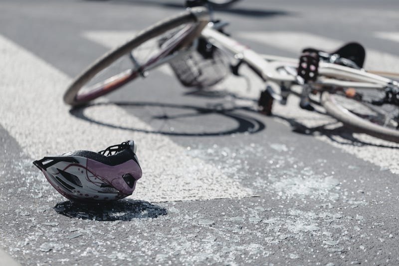 Bike and helmet lying in the road