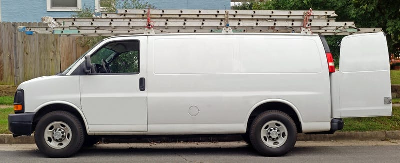 White van with ladder on top