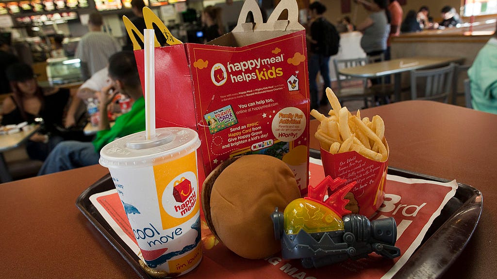 Young boy gives up his meal to a family turned away from McDonald's drive-thru for not having a car