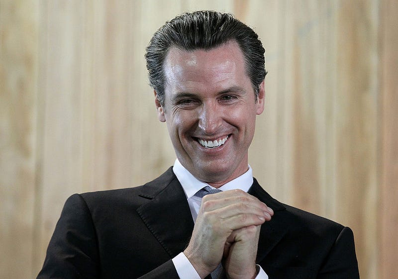 San Francisco mayor and California Lt. Governor-elect Gavin Newsom smiles during a ribbon cutting during the grand opening of the Lowe's store on November 4, 2010 in San Francisco, California.