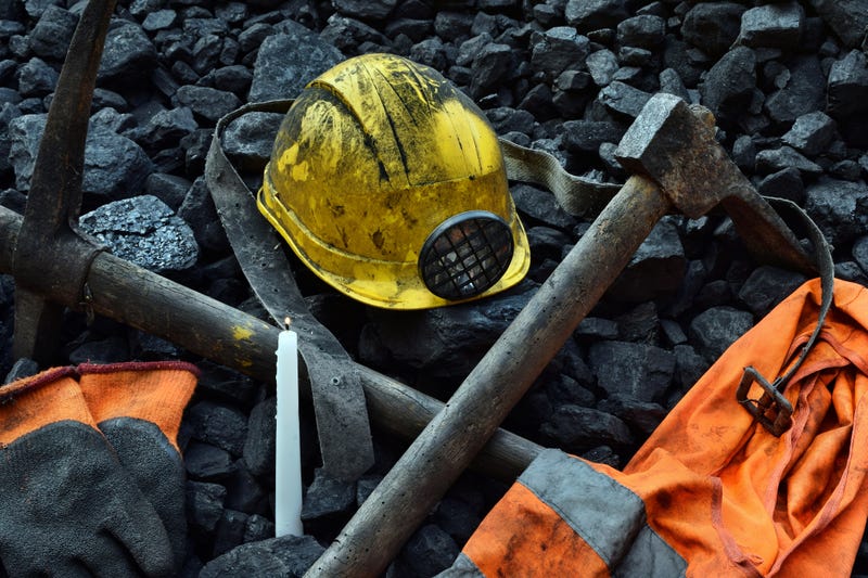 (Helmet, gloves, pickaxe, vest, belt) - stock photo