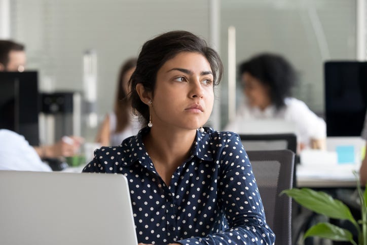 unhappy woman at work