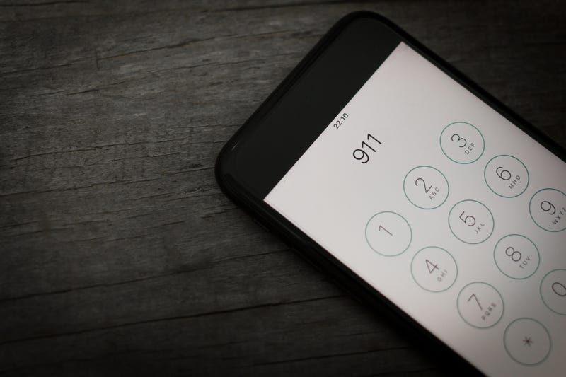 911 dialed on smartphone screen.