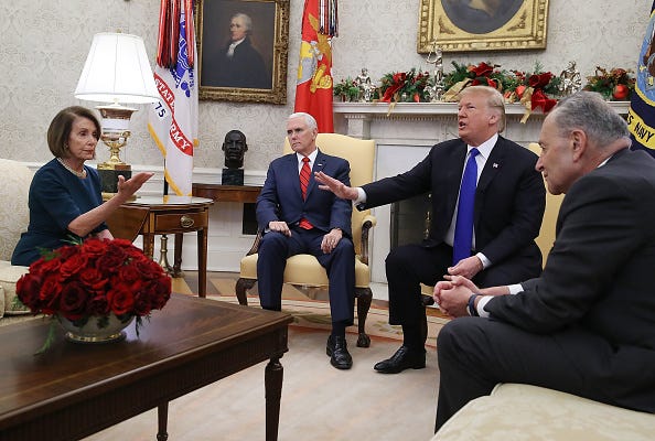 U.S. President Donald Trump (2R) argues about border security with Senate Minority Leader Chuck Schumer (D-NY) (R) and House Minority Leader Nancy Pelosi (D-CA) as Vice President Mike Pence sits nearby in the Oval Office on December 11, 2018 in Washington, DC. 