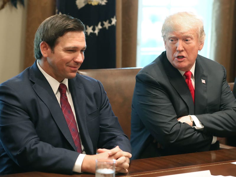 Florida Governor-elect Ron DeSantis (R) sits next to U.S. President Donald Trump during a meeting with Governors elects in the Cabinet Room at the White House on December 13, 2018 in Washington, DC.