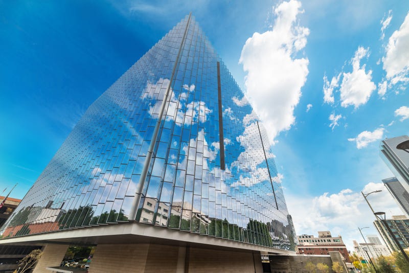 tall glass courthouse reflecting sky