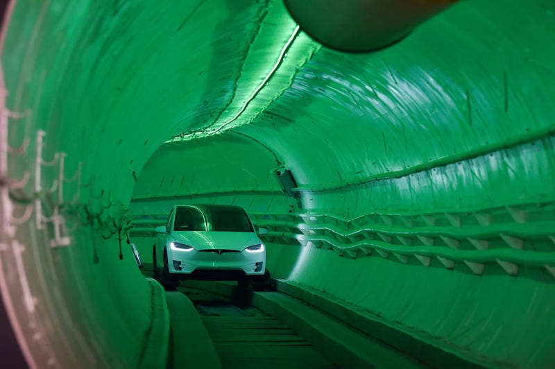 Elon Musk, co-founder and Chief Executive Officer of Tesla Inc., arrives in a modified Tesla Model X electric vehicle during an unveiling event for The Boring Company Hawthorne test tunnel on December 18, 2018, in Hawthorne, California.