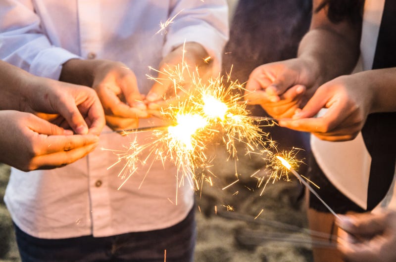 sparklers in people hands