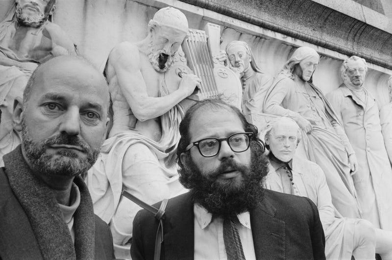 American Beat poets Lawrence Ferlinghetti (left) and Allen Ginsberg (1926 - 1997) at the Albert Memorial in South Kensington, London, 11th June 1965.