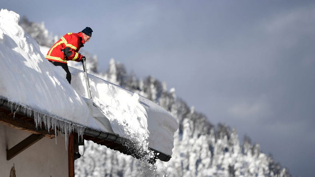 Rain falling on snow raises concerns of collapsing roofs, floods