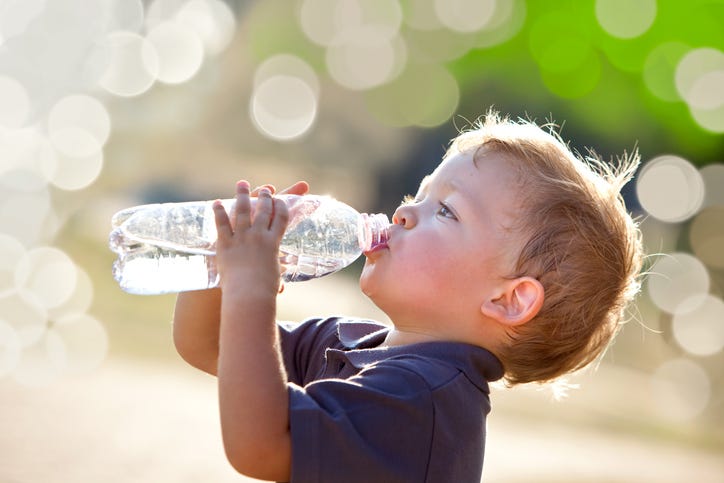 Young boy drinking