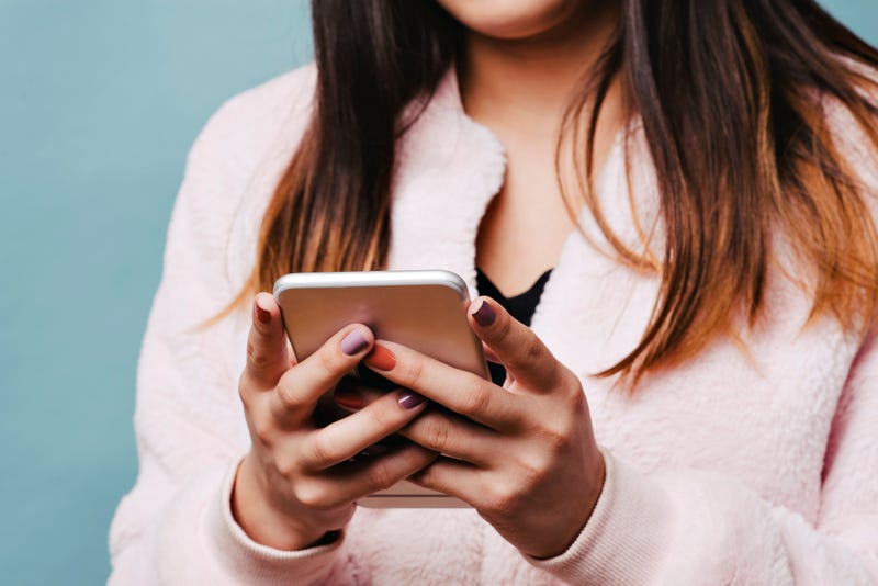 Young female looking at her phone.