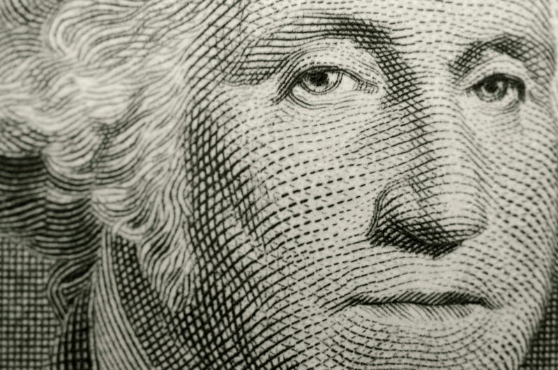 Close up of George Washington on the dollar bill.