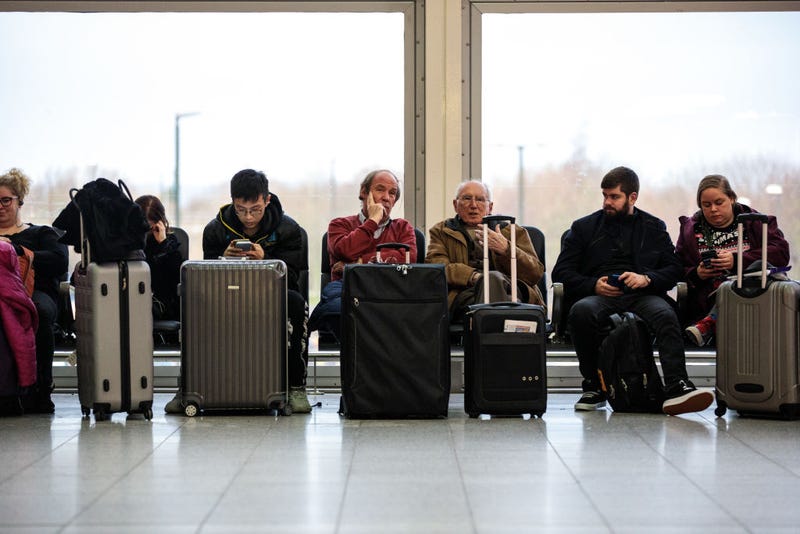 airline passengers wait for delays