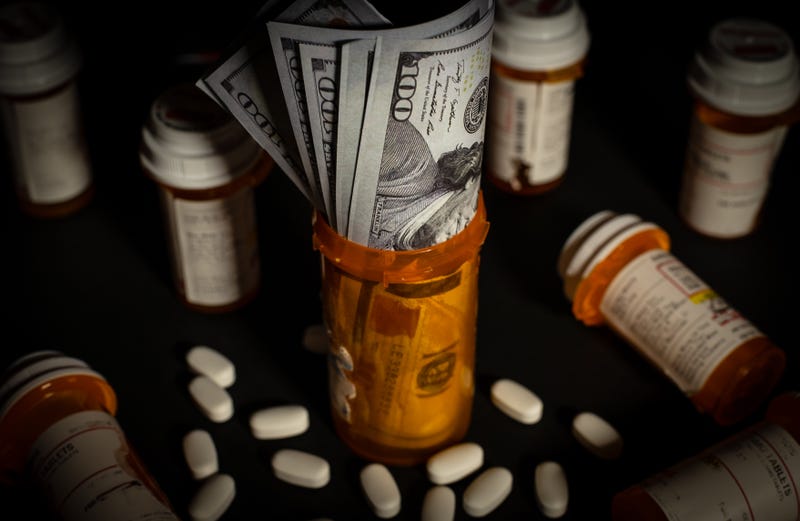 hundred dollar bills inside prescription pill bottle