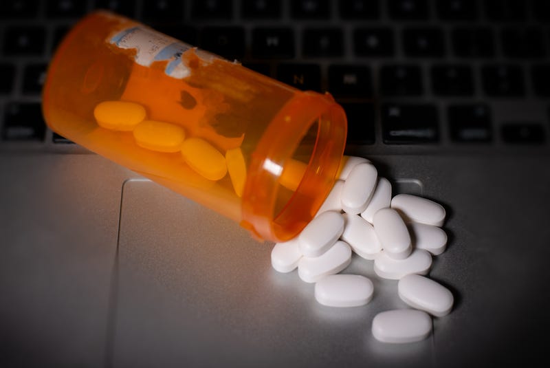 Pills on top of computer