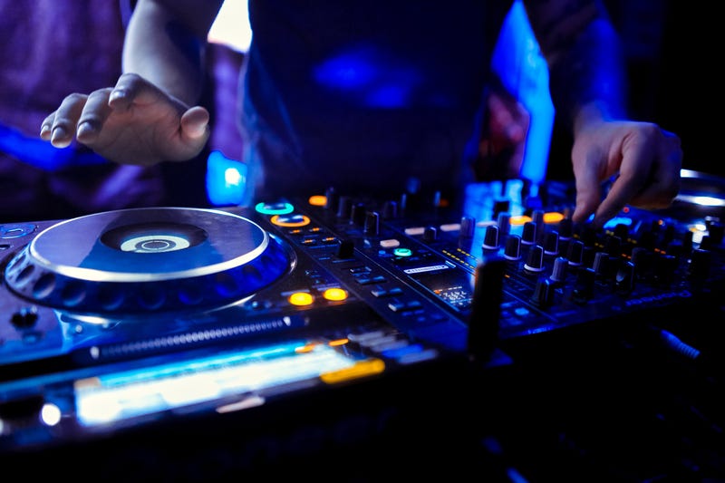 DJ on turntables.