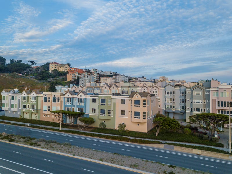 The uniformity of windows on row houses in San Francisco's Ocean Beach.