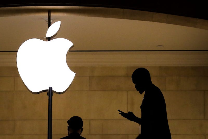 A man checks his phone in an Apple retail store in Grand Central Terminal, January 29, 2019 in New York City.