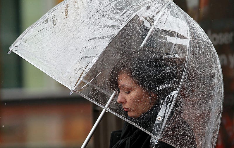 A pedestrian carries an umbrella as she walks down Market Street on February 17, 2011 in San Francisco, California.