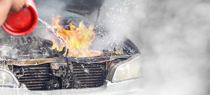 Car burning at parking lot.