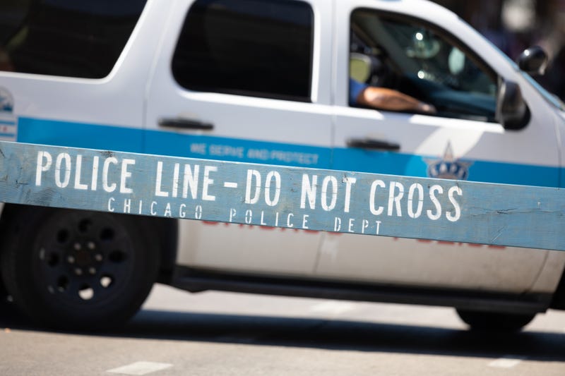 A Chicago police SUV in front of a barrier.