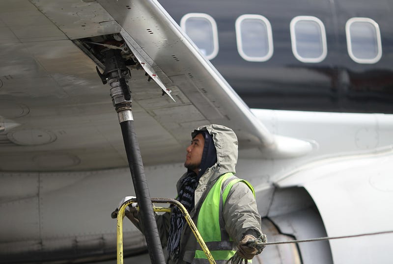 Swissport employee refueling an airplane in 2011.