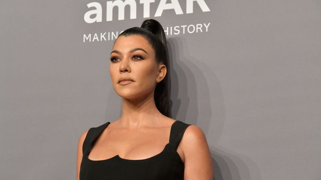 Kourtney Kardashian stuns in a sizzling black crop top while referencing famous ‘KUWTK’ phrase