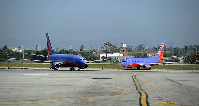 Two Southwest Airlines Boeing 737-700 passenger jets taxis on the tarmac after arriving at Los Angeles International Airport on April 5, 2011 in Los Angeles, California.